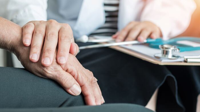 Geriatric doctor consults with Alzheimer's patient