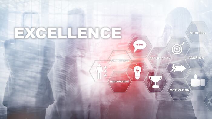 Achieve Business Excellence as concept. Pursuit of excellence. Blurred business center background. - Image