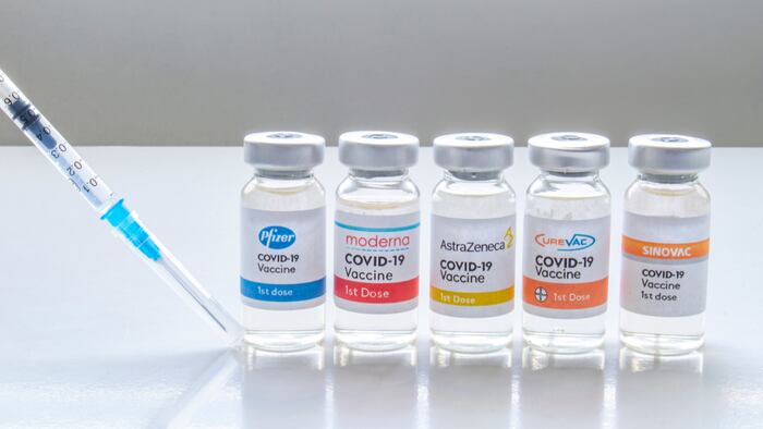 Several vials vaccine bottles of covid-19 immunization popular vaccines brands in the world