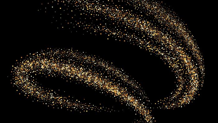 gold swirl of dust on black background