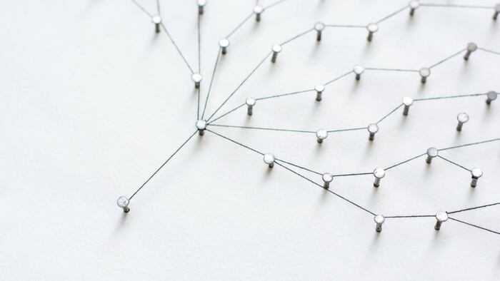 Linking entities, Network simulation, social media, Communications Network, The connection between the two networks. in paper linked together by cotton with a black yarn - Image