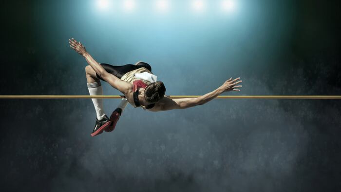 Athlete in action of high jump.