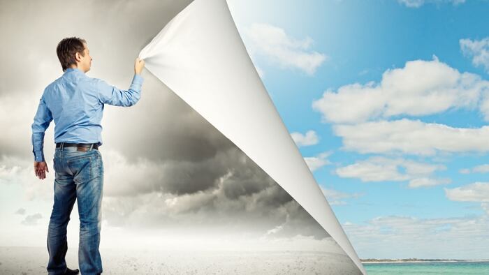 Man in jeans changing page to more colorful reality. Transformation metaphor.
