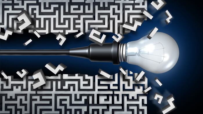 Innovative idea solution concept and new thinking business symbol as a light bulb breaking through a maze or labyrinth as an icon for innovation and invention. - Illustration