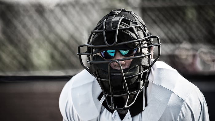 Umpire with bright sunglasses