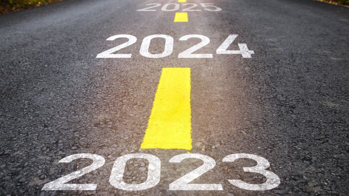 2023, 2024 and 2025 sprayed onto a road