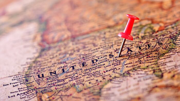 Map of USA with a red pushpin stuck - Image
