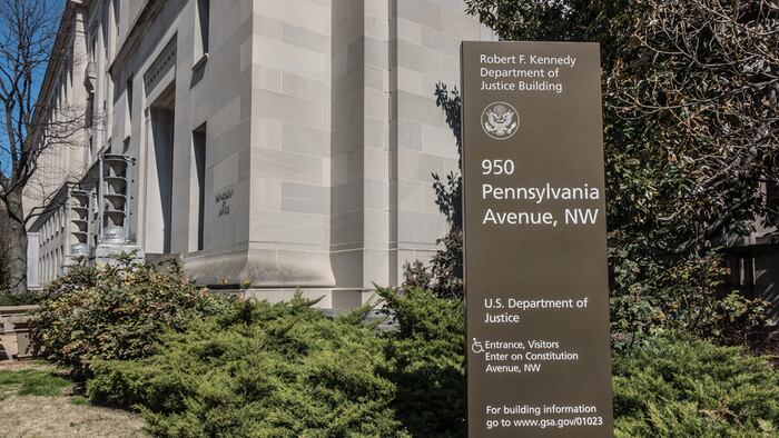 WASHINGTON, DC - MARCH 2018: Headquarters of the U.S. Justice Department. Art Deco aluminum torcheres at doorway. Renamed the Robert F. Kennedy Department of Justice Building in 2001.