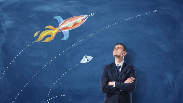 Man Looking At Abstract Rocket Signifying Sales