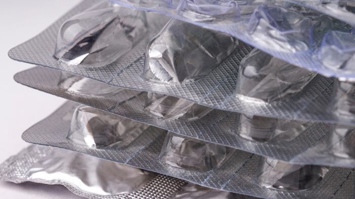 Empty blister packs, drug shortage concept. used empty packaging from pills close up