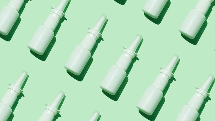 Nasal sprays on green background