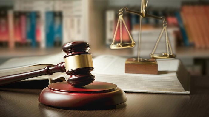 Gavel scales law book (Proxima Studio/Shutterstock.com)