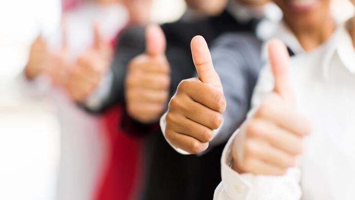 closeup portrait of business people giving thumbs up - Image