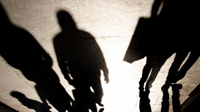 people in shadows