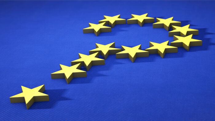 Question mark of yellow stars against blue background