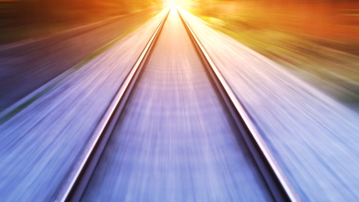 train fast run on railway track in sunny day