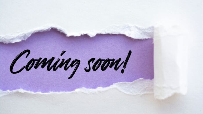Piece of torn paper reading 'Coming soon!'
