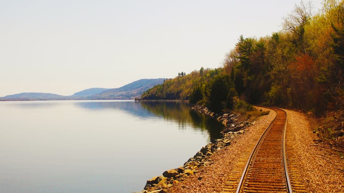 Railroad tracks seen from the back of an Adirondack train heading to Montreal, Canada, from New York, USA.