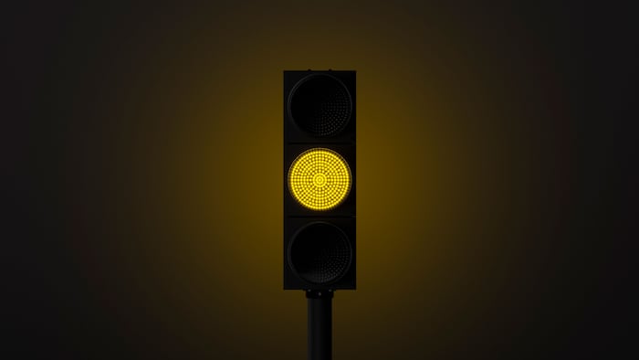 glowing yellow traffic light