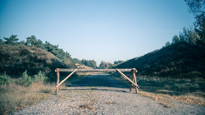 Wooden roadblock in nature