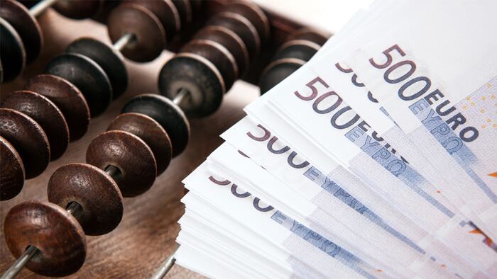 old abacus with bills of 500 euros close up