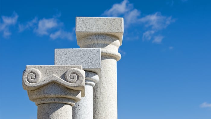 three capitals of granite columns displayed in a shop canteria - Image