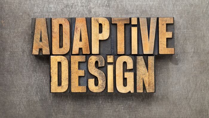adaptive design - text in vintage letterpress wood type against grunge metal surface
