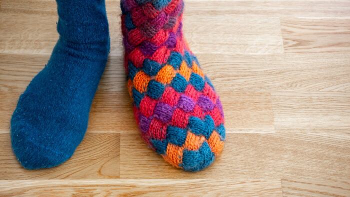close up of feet in mismatched socks