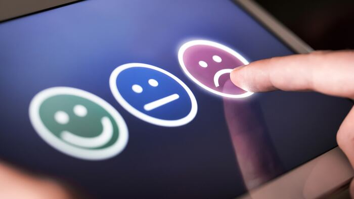 Unhappy and disappointed customer giving low rating and negative feedback in survey, poll or questionnaire. Sad and dissatisfied man giving review about service quality. Bad user experience. - Image