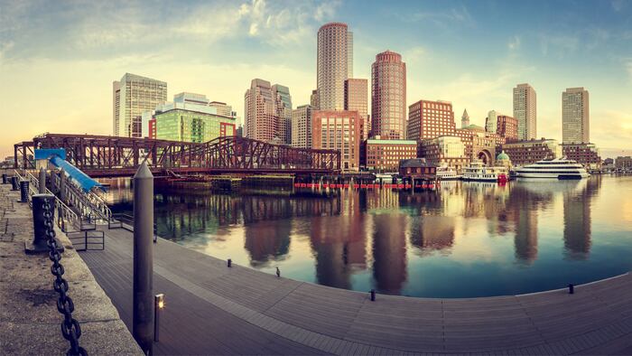 View of the Boston Harbor in Boston, Massachusetts, USA with its mix of modern and historic architecture in a cross processed image.