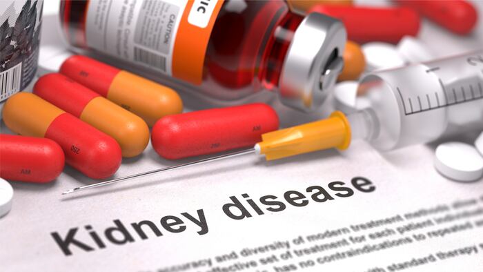 Kidney Disease - Printed Diagnosis with Red Pills, Injections and Syringe. Medical Concept with Selective Focus.