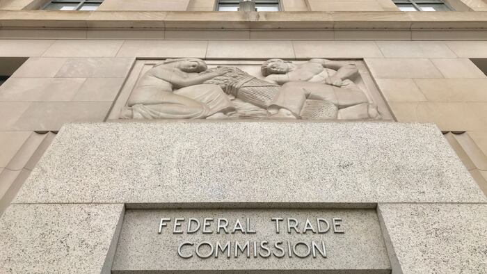 FTC FEDERAL TRADE COMMISSION headquarters building entrance with sign above door and exterior.