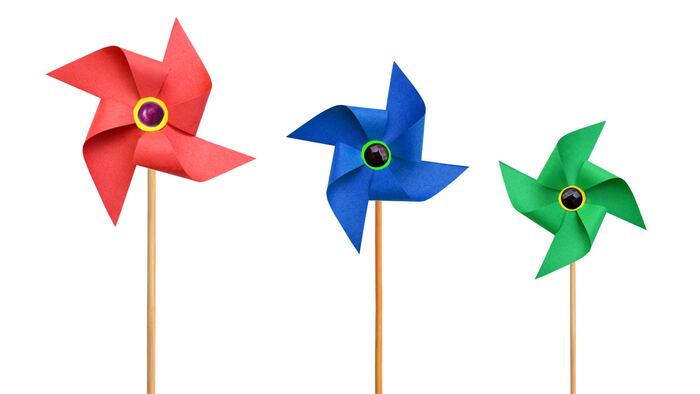 Three Paper pinwheels isolated on white background