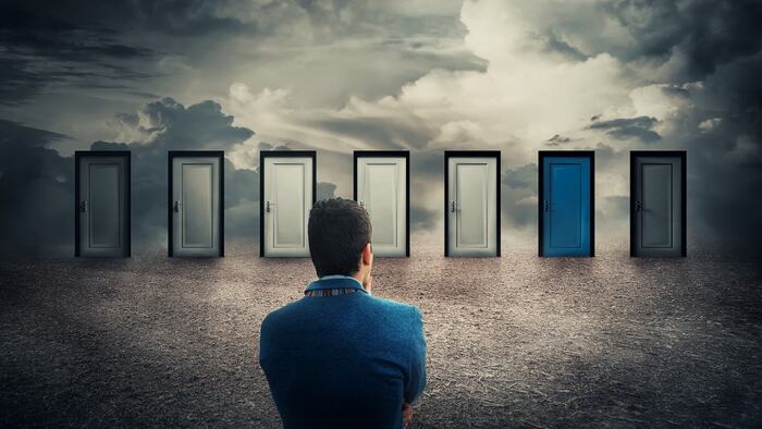 business man choosing between different doors, choice concept