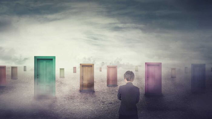 Businesswoman in front of many different doors choosing one. Difficult decision, important choice concept, failure or success.